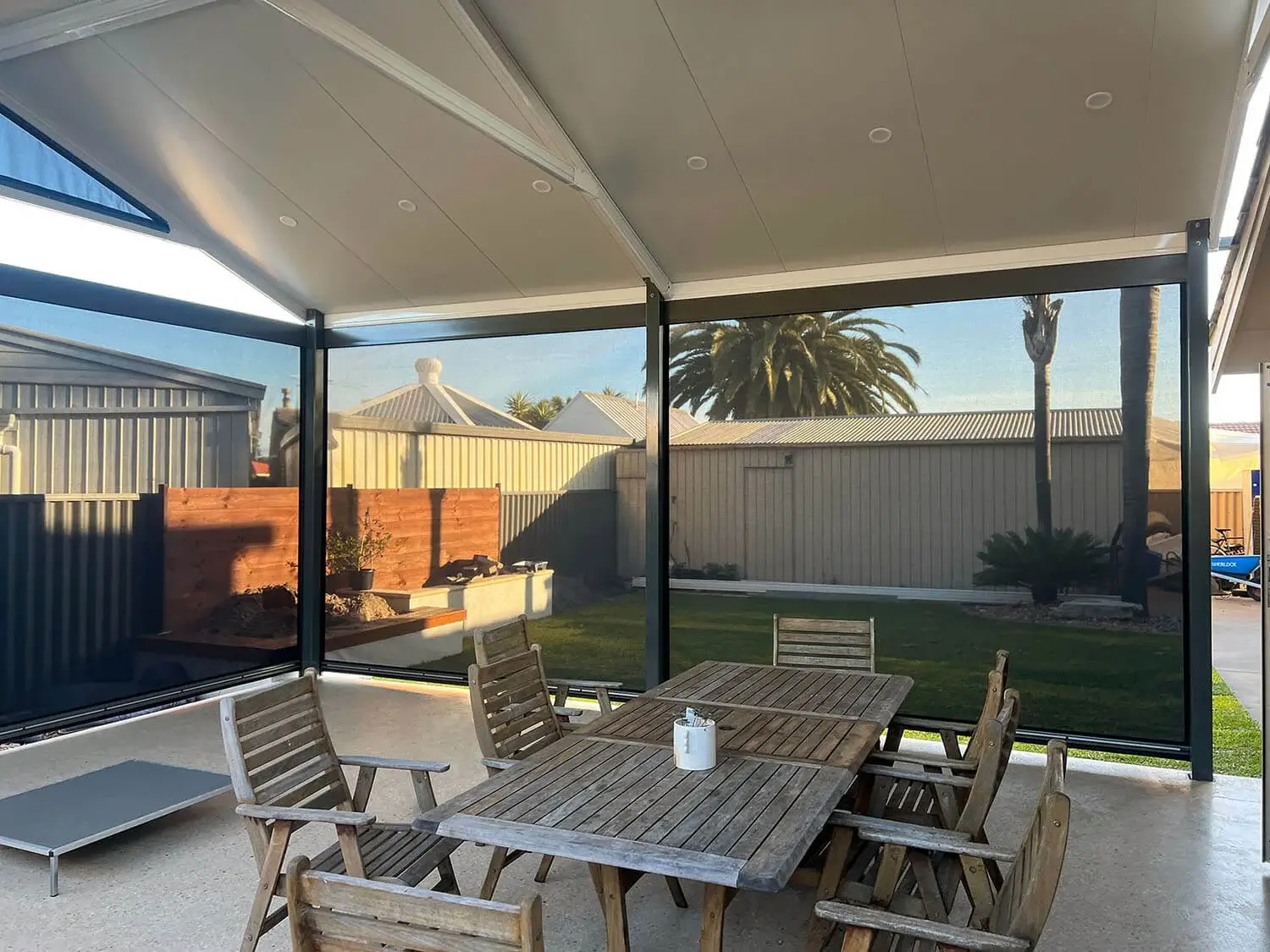 the inside of a patio with outdoor patio blinds