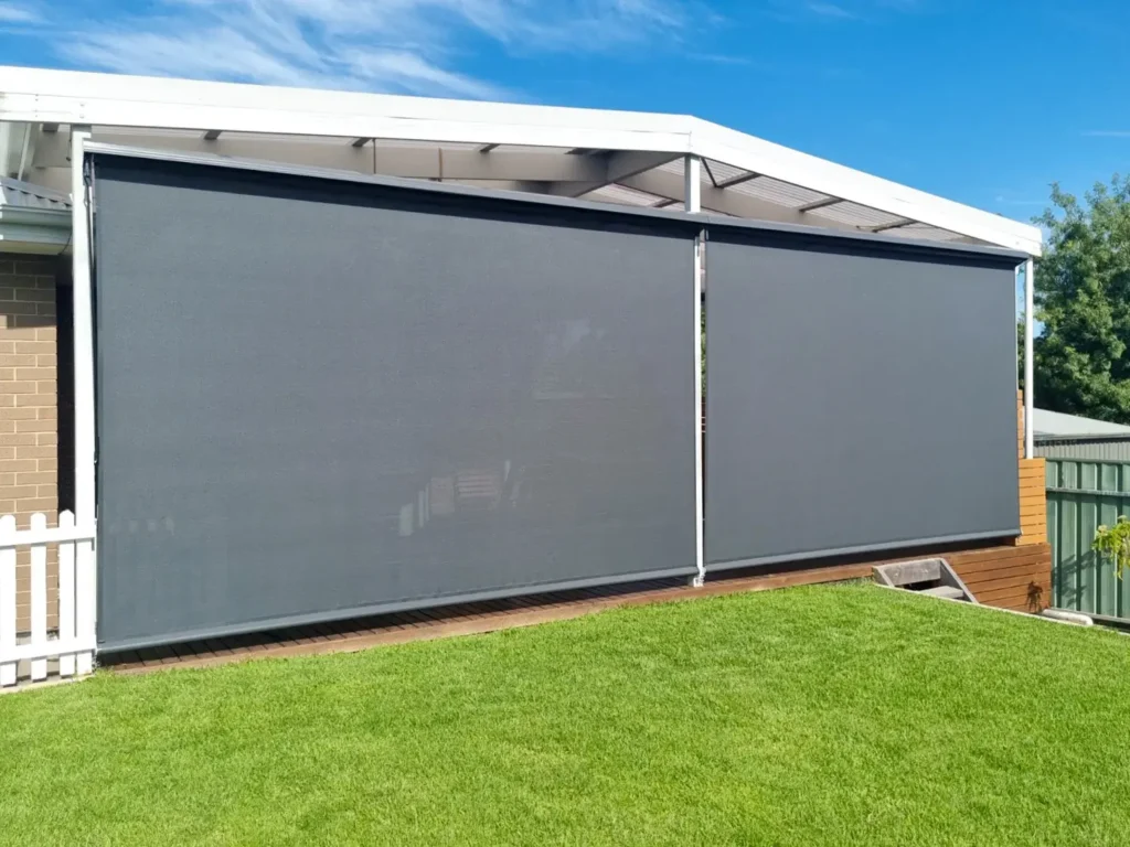 Patio with straight drop blinds providing sun protection